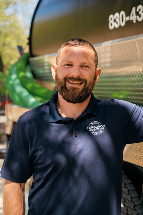 Ferguson & Sons Septic Pumping Truck and Employee