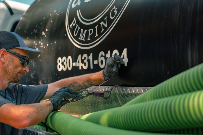 Ferguson & Son Septic Pumping Employee & Truck