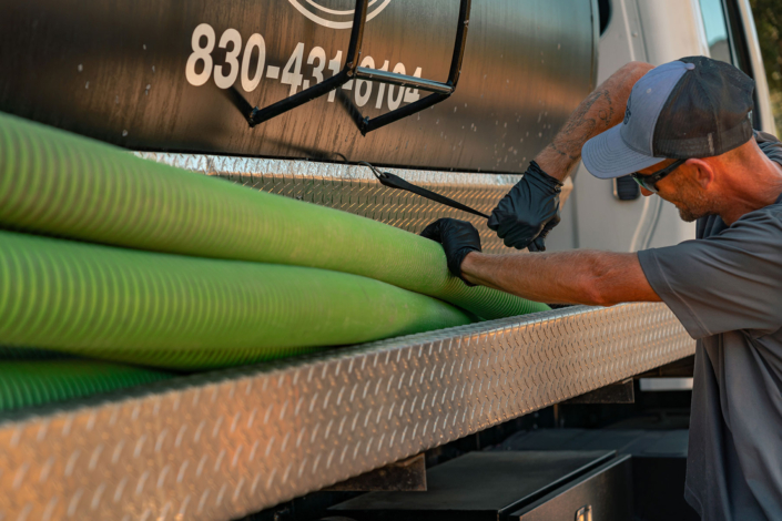 Ferguson & Son Septic Pumping Employee & Truck