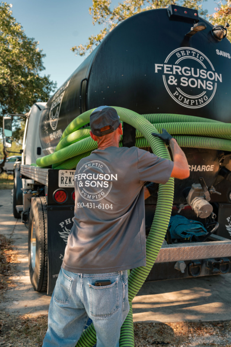 Ferguson & Son Septic Pumping Truck and Employee