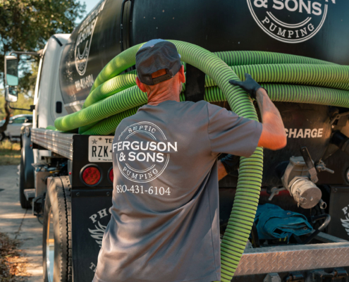 Ferguson & Son Septic Pumping Truck and Employee