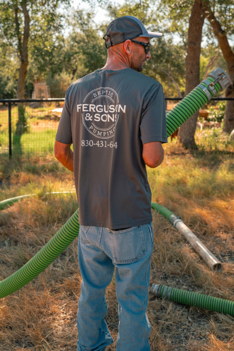 Ferguson & Son Septic Pumping Employee with Hose